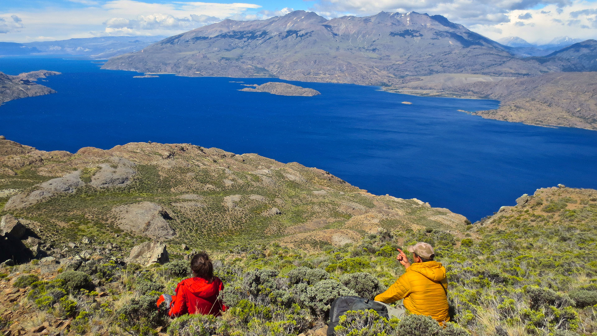Hikers overlooking Lake Cochrane in Patagonia National Park, Chile