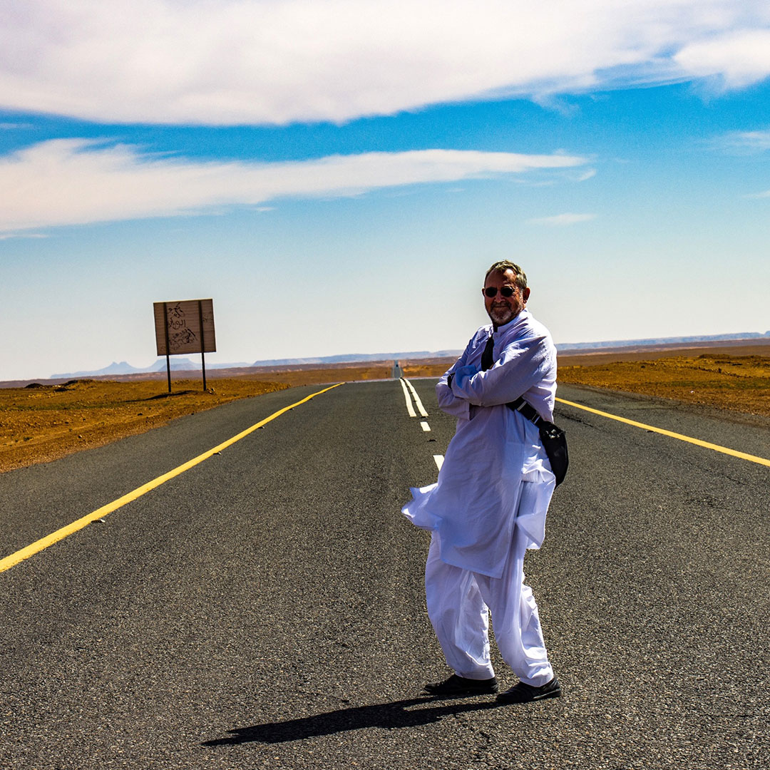 GeoEx trip leader Bill Jones on a road in Saudi Arabia