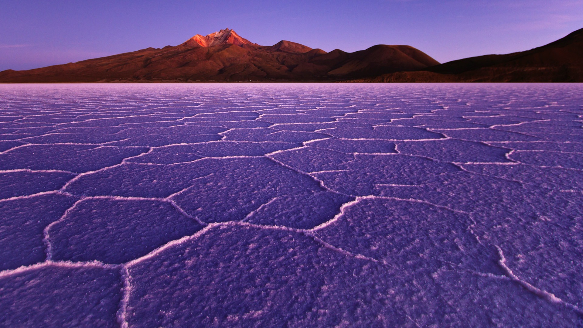Hexagon patterns on the Salar de Uyuni at sunrise, Bolivia