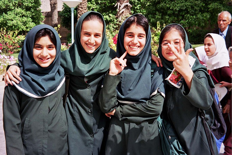 Smiling Iranian girls outside of Saadi teahouse, Iran