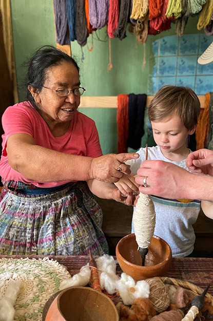 Spinning yarn with a weaver in Lake Atitlan, Guatemala