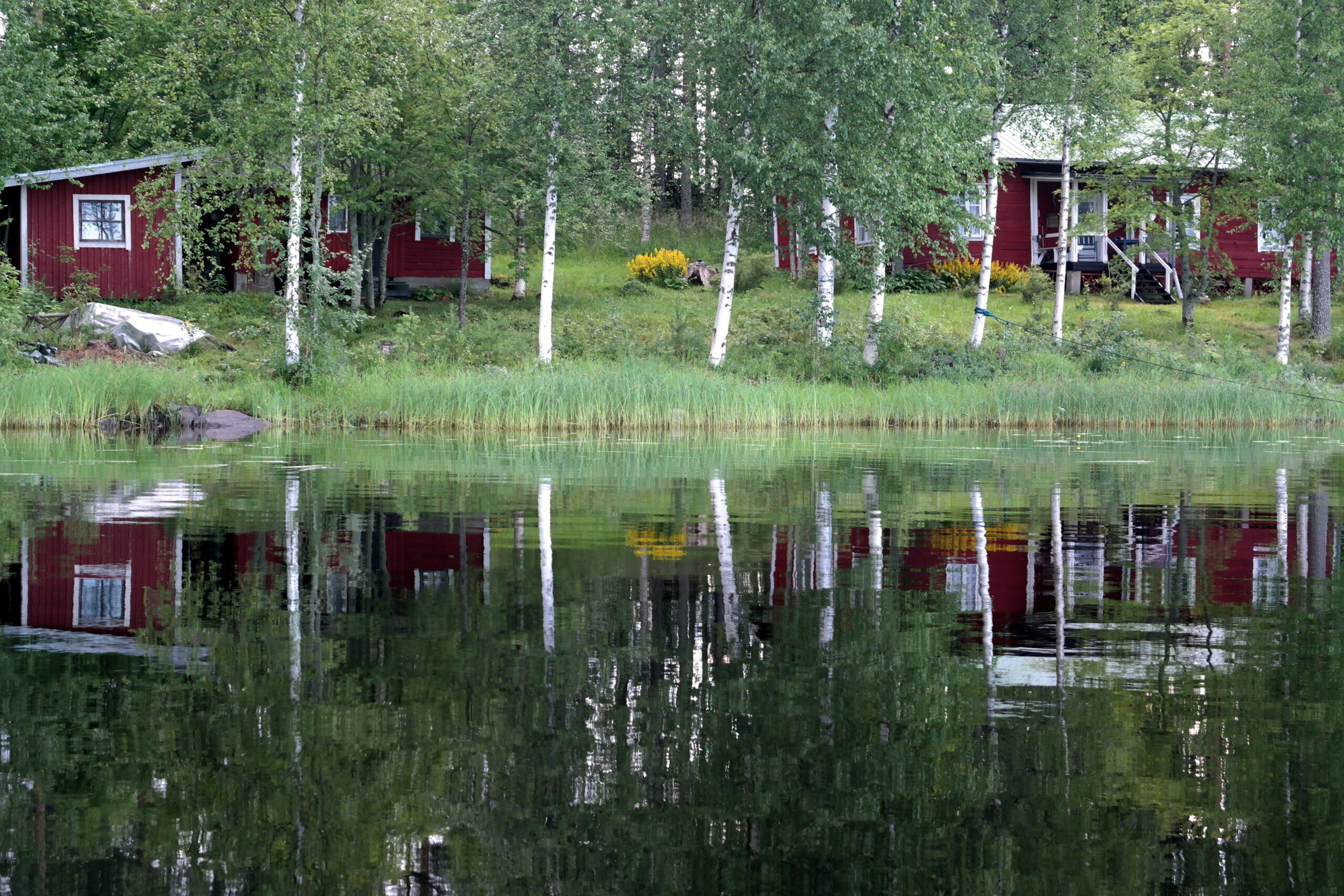 Travel Photo: reflections on a lake in Pisankoski, Finland.