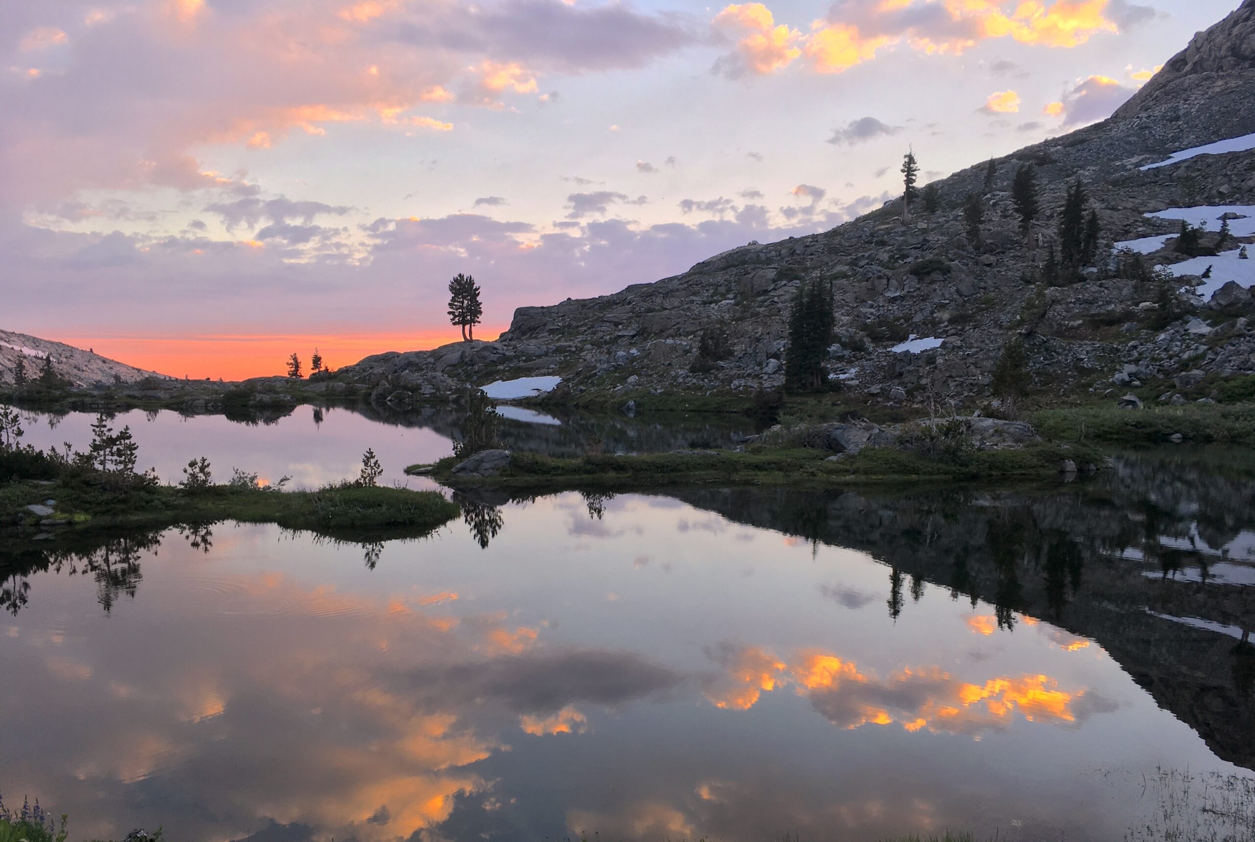 Travel Photo: sunset reflecting on water at Desolation Wilderness in California.